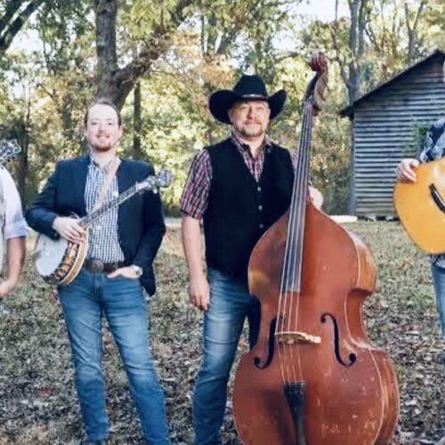 Edgar Loudermilk Band performing bluegrass outdoors with mandolin, banjo, upright bass, and guitar
