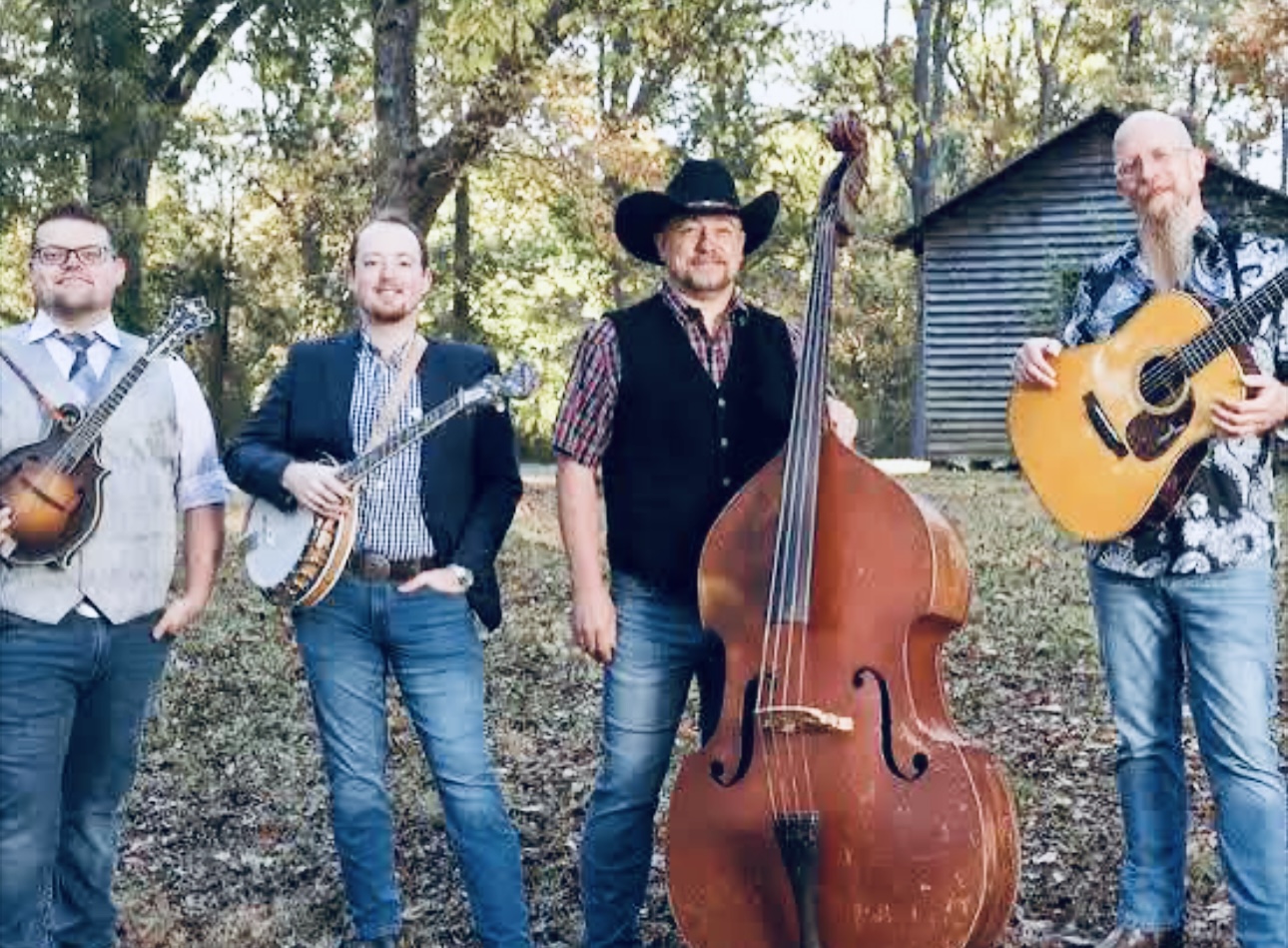 Edgar Loudermilk Band performing bluegrass outdoors with mandolin, banjo, upright bass, and guitar